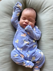 Max wrapped in a cozy blanket at home, looking healthy and alert after growing to 7 pounds, 4 ounces.