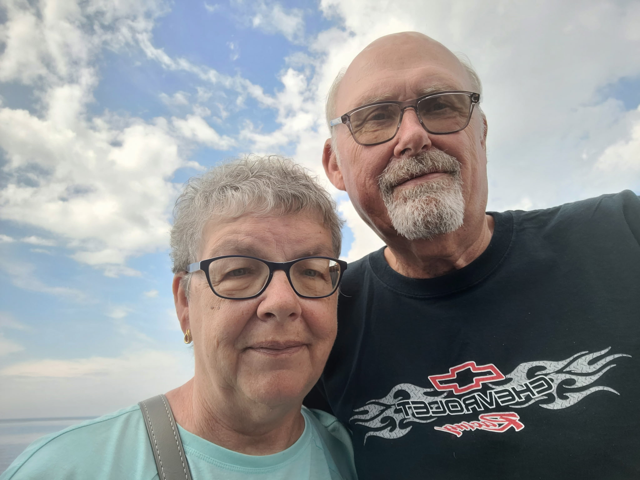 Cardiac rehab patient Kenny Eckhoff with his wife Sharon smiling together after his open-heart surgery recovery at Waverly Health Center.