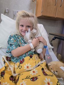 Child patient Isla receiving ear tube surgery at Waverly Health Center